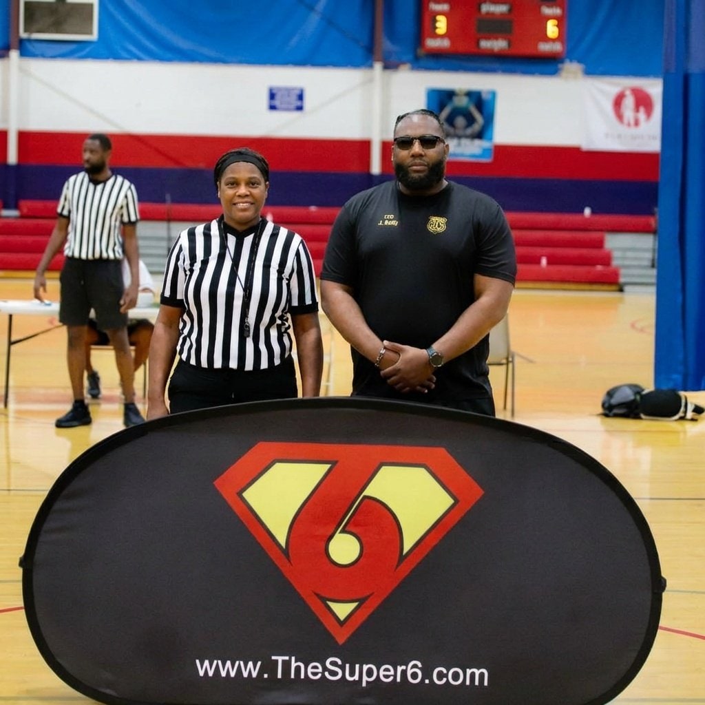 Referee and coach in partnership at the start of a Super6 game