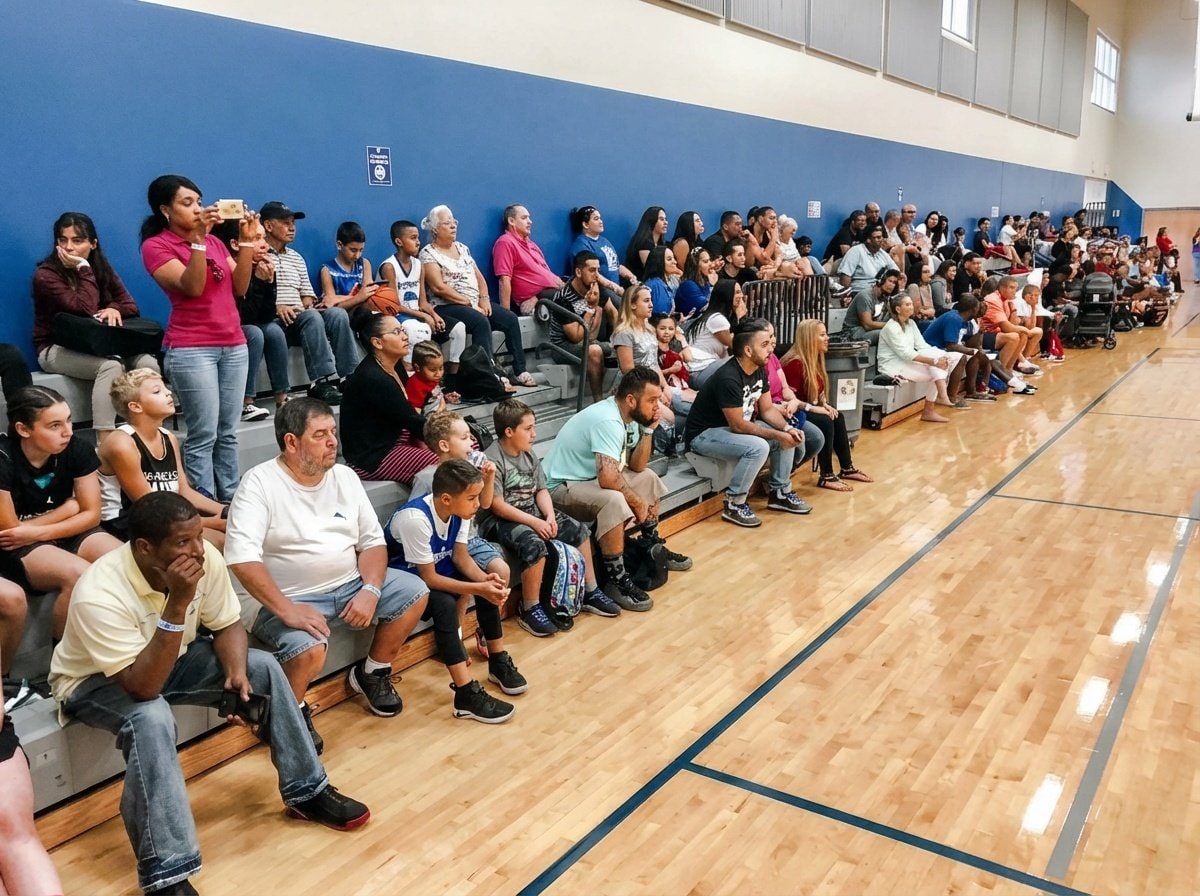 Multi-row crowd of spectators along the court