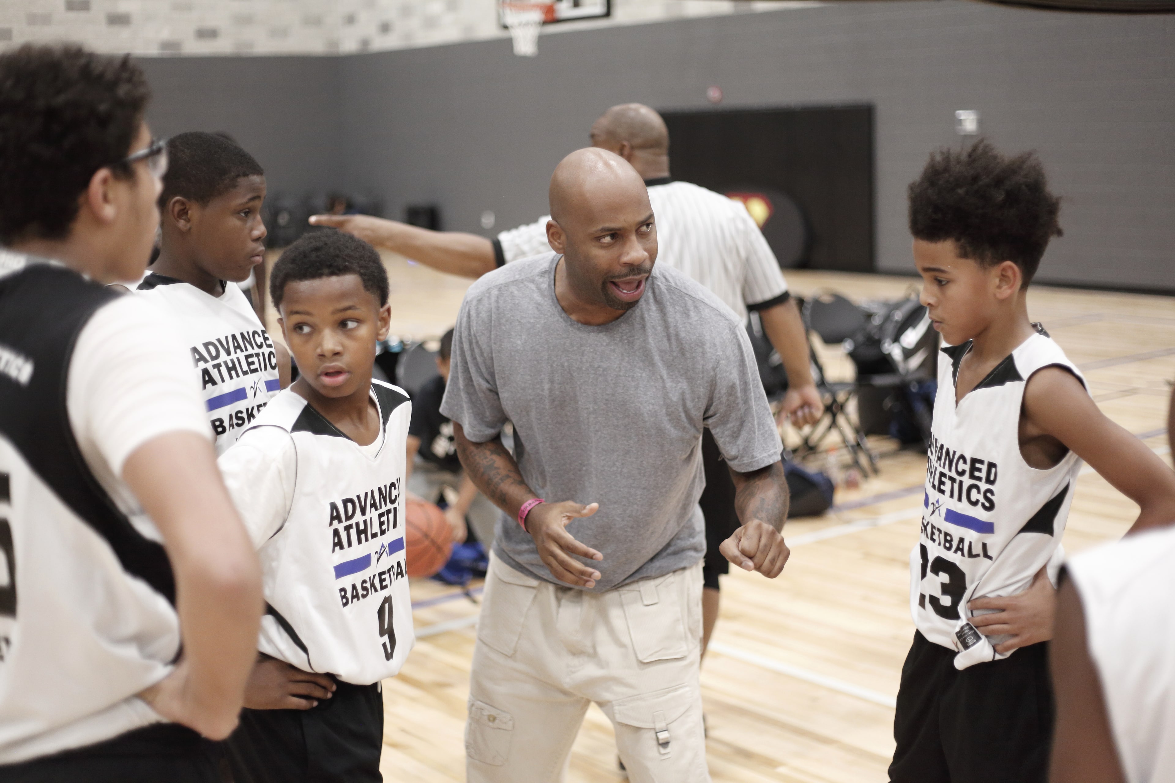Youth coach in a huddle with players