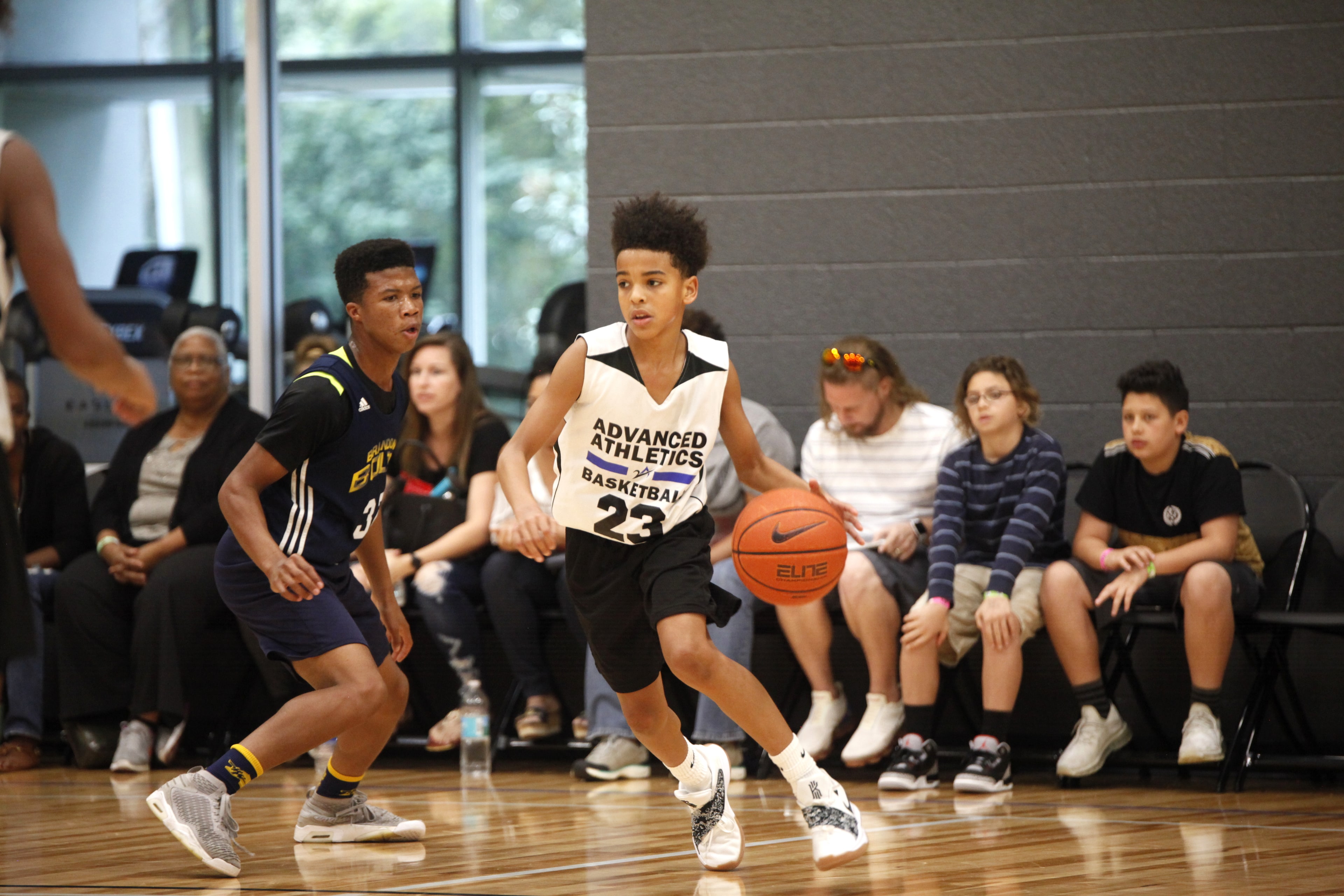 Young point guard pushing the ball up the floor