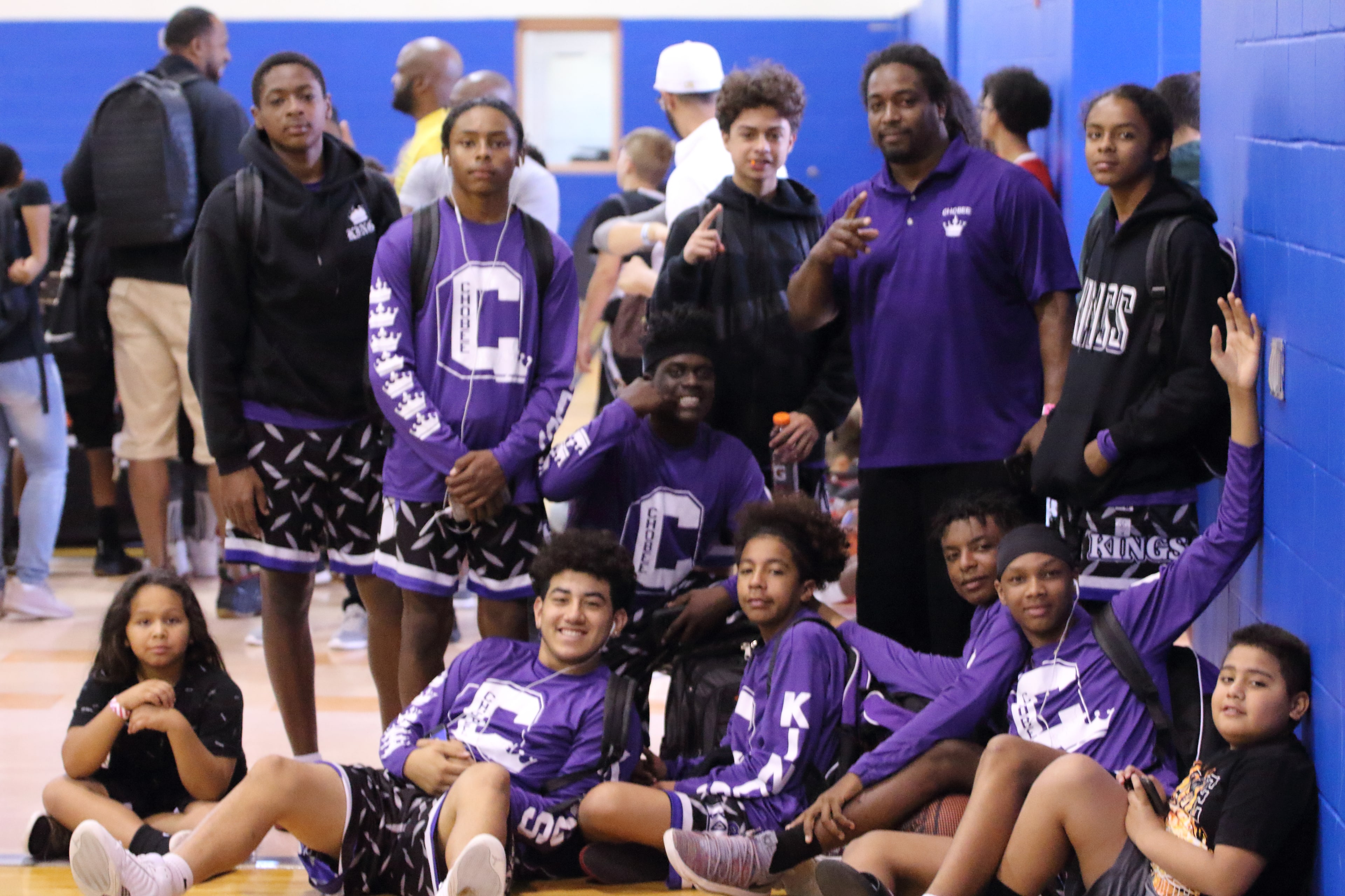 Squad of players in purple Kings gear posing together