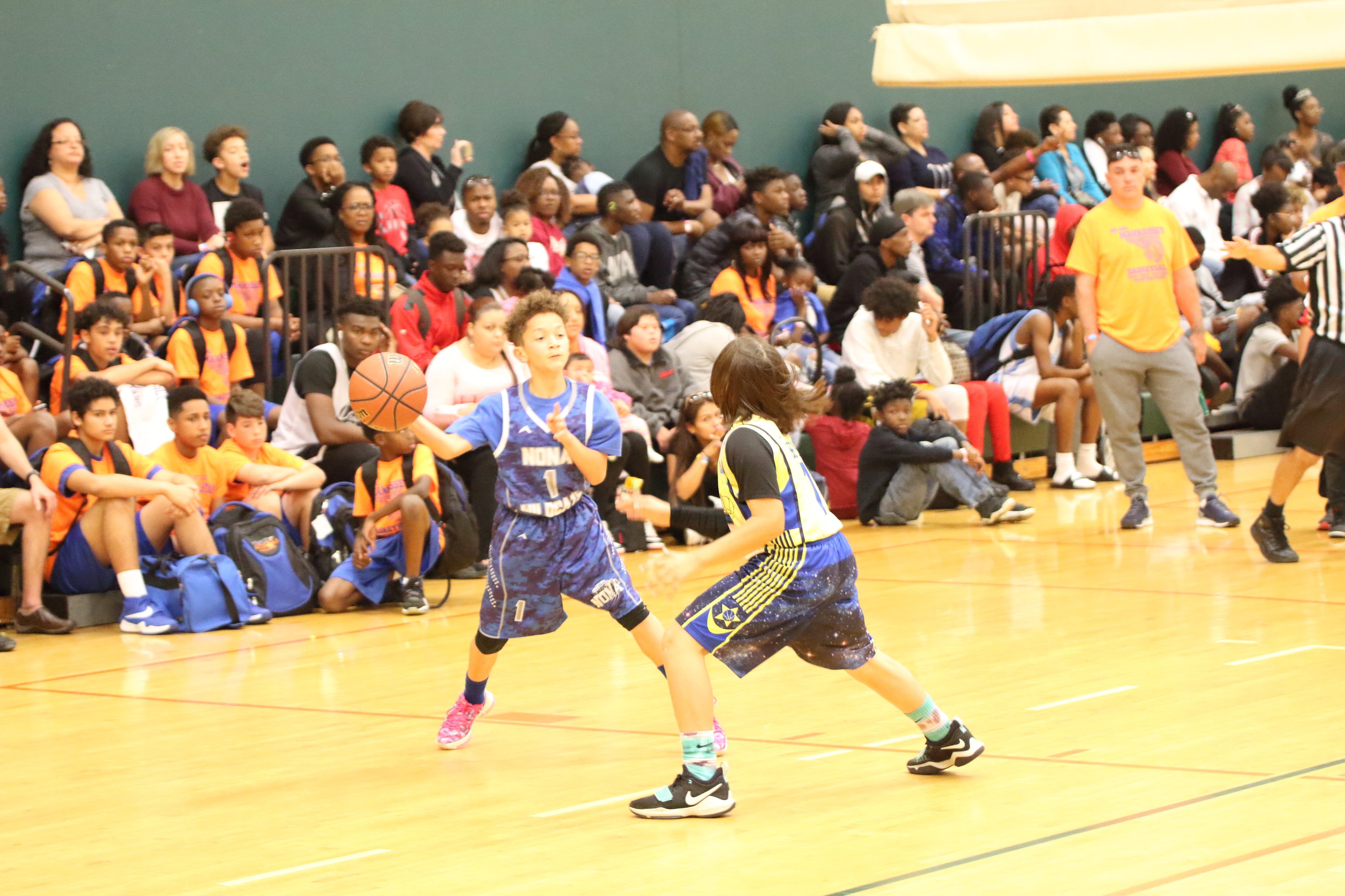 Youth game action mid-possession