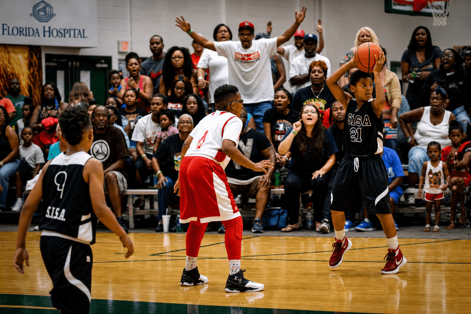 Super6 player squaring up to shoot in front of a packed Florida Hospital gym crowd.